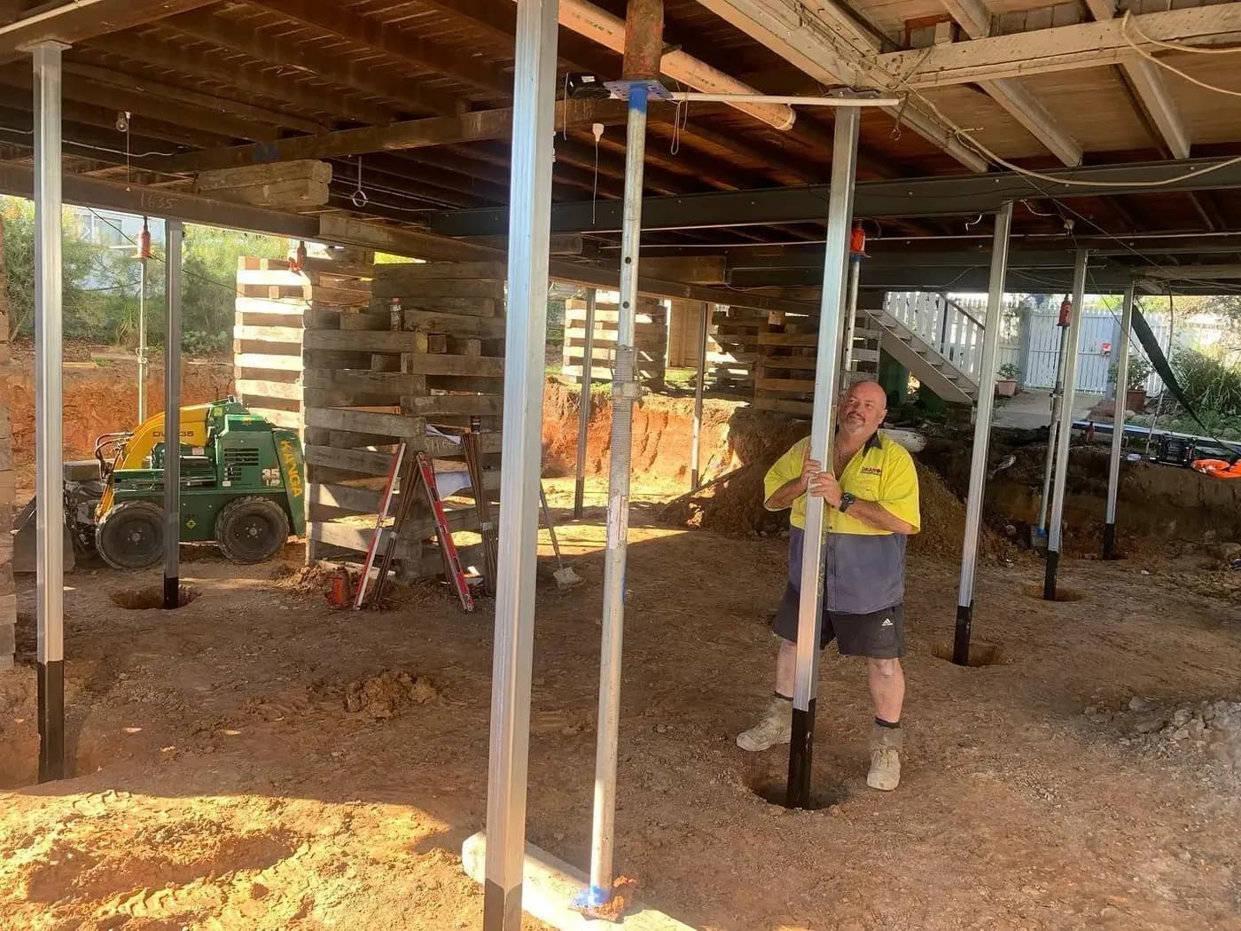 Working underneath a raised house on a Deano’s Restumping job site
