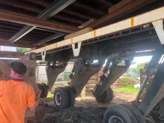 Machinery being positioned for an on-site house move