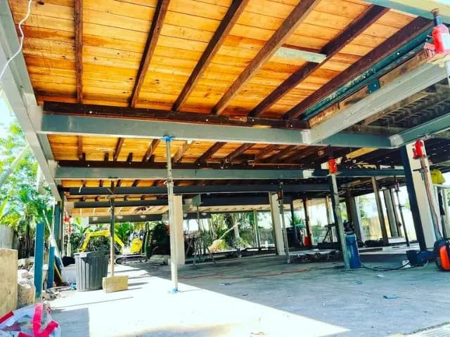 Steel bearers spanning the underside of a raised home