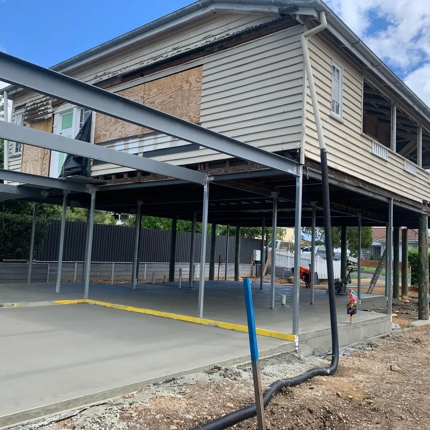 Structural steel frame installed beneath a raised house